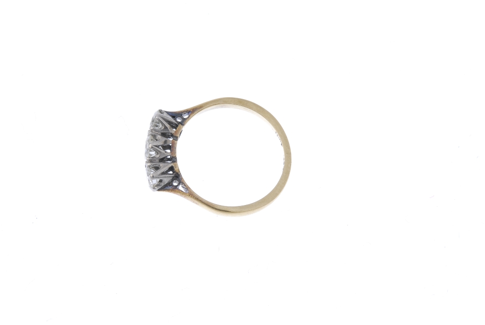 A mid 20th century 18ct gold and platinum diamond three-stone ring. The graduated circular-cut - Image 3 of 4