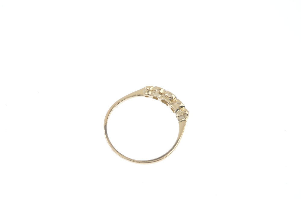 A mid 20th century 18ct gold diamond ring. The graduated vari-cut diamond collet line, to the - Image 4 of 4