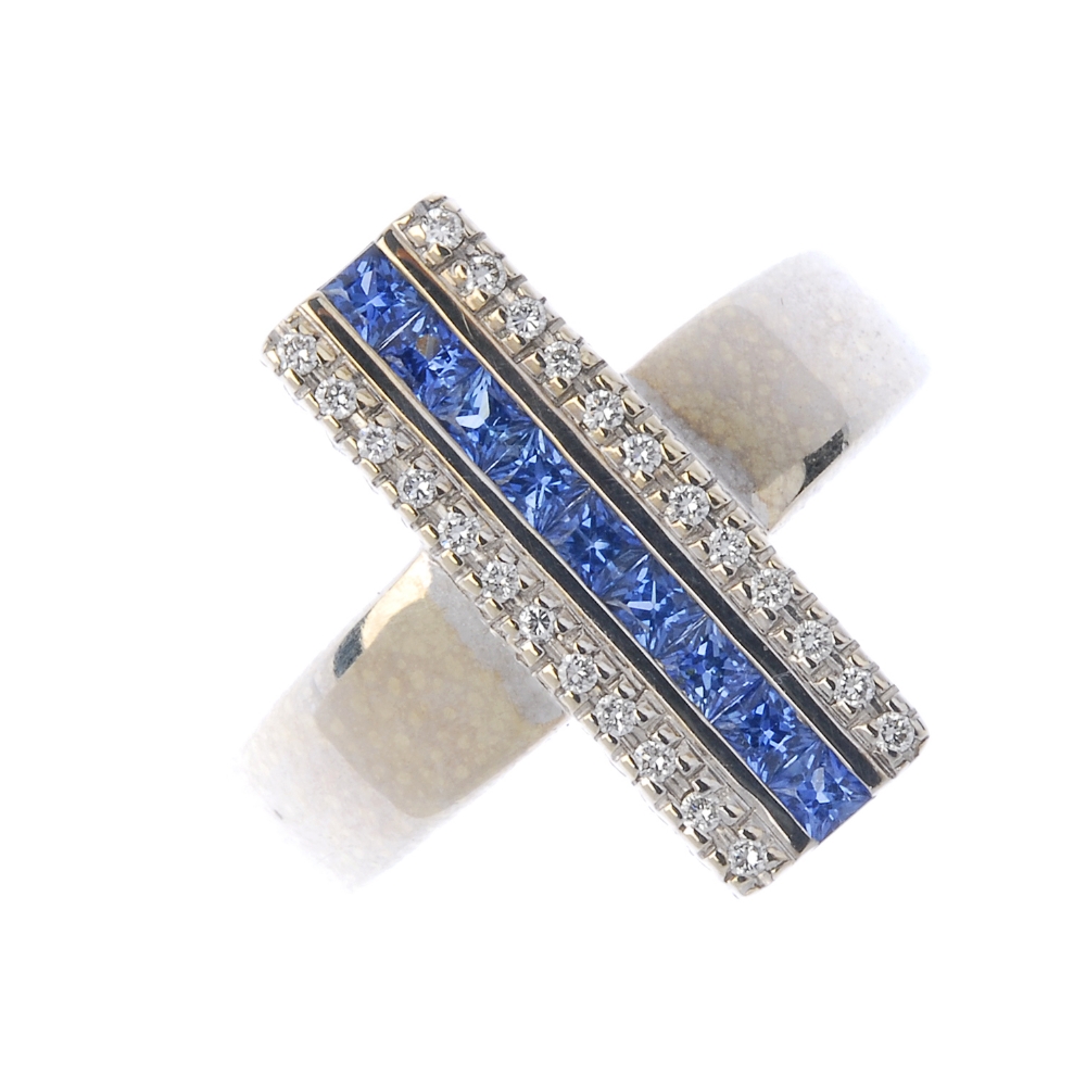 An 18ct gold sapphire and diamond dress ring. The square-shape sapphire line, with brilliant-cut