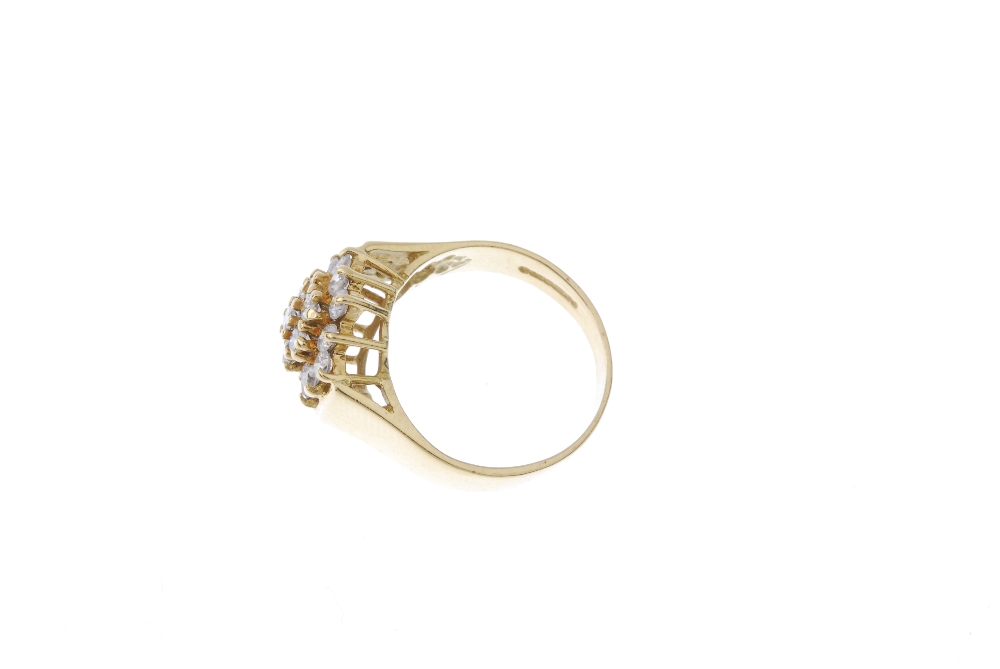 An 18ct gold diamond cluster ring. The brilliant-cut diamond stepped cluster, to the plain band. - Image 3 of 4