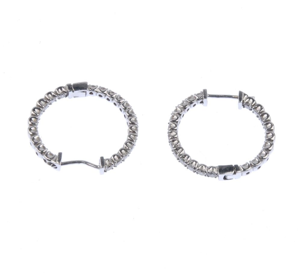 (539290-3-A) A pair of 14ct gold diamond hinged ear hoops. Each designed as a brilliant-cut - Image 3 of 3