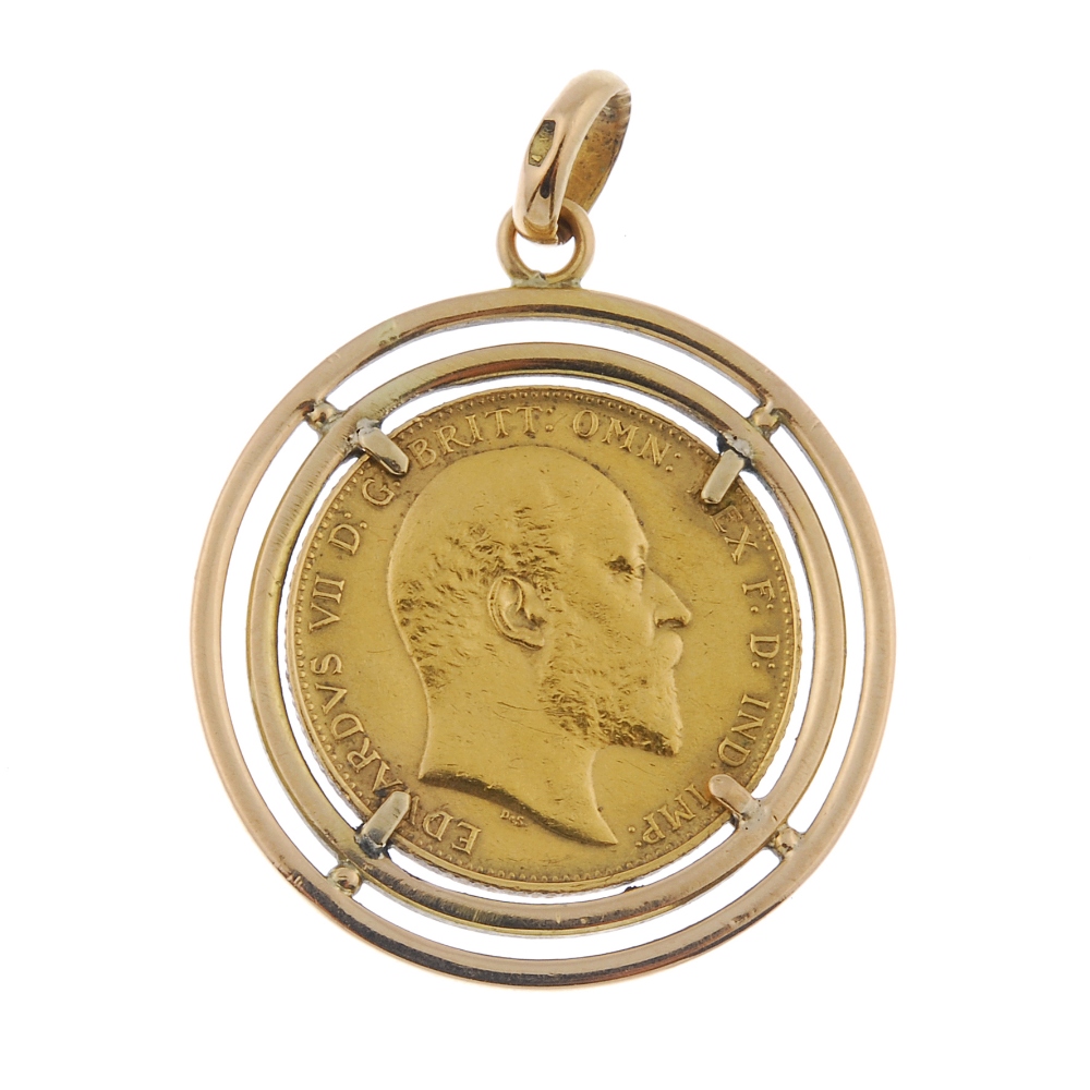 A mounted sovereign pendant. The Edward VII sovereign, dated 1904, within a later double halo,