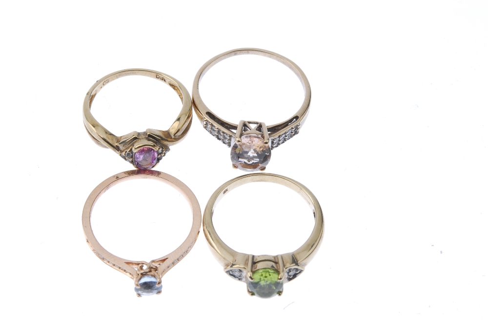 A selection of four gold diamond and gem-set rings. To include a circular-shape blue topaz and - Image 2 of 3