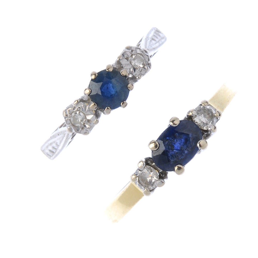 Two sapphire and diamond three-stone rings. To include an 18ct gold circular-shape sapphire and