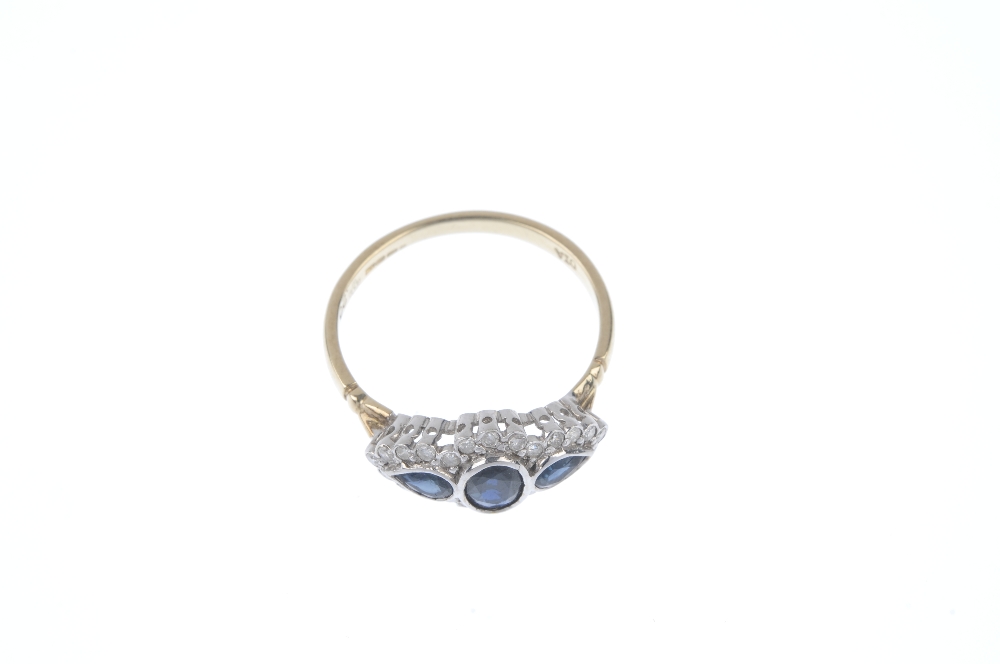 An 9ct gold sapphire and diamond dress ring. The oval-shape sapphire and pear-shape sapphire - Image 2 of 4