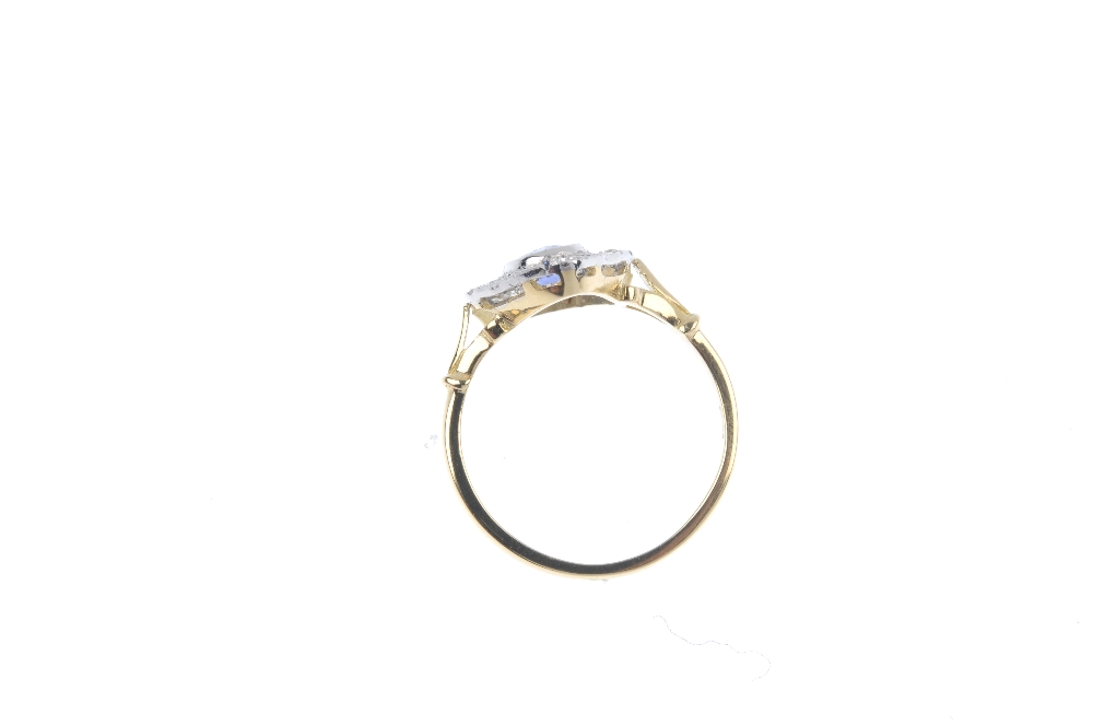 A sapphire and diamond cluster ring. The oval-shape sapphire collet, within an openwork single and - Image 4 of 4