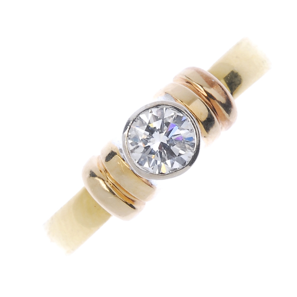 An 18ct gold diamond single-stone ring. The brilliant-cut diamond collet, to the curved double-bar