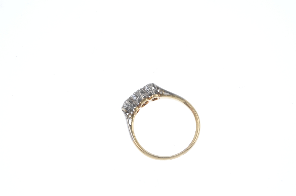 A mid 20th century gold and platinum diamond three-stone ring. The brilliant-cut diamonds, to the - Image 4 of 4