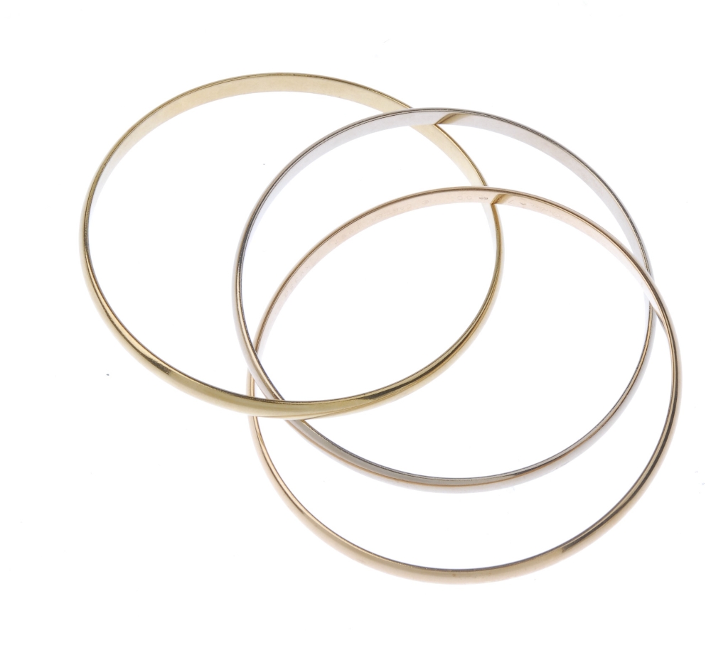 (544516-7-A) CARTIER - a 'trinity' bangle. Comprising three, tri-colour, interwoven bangles. - Image 2 of 2