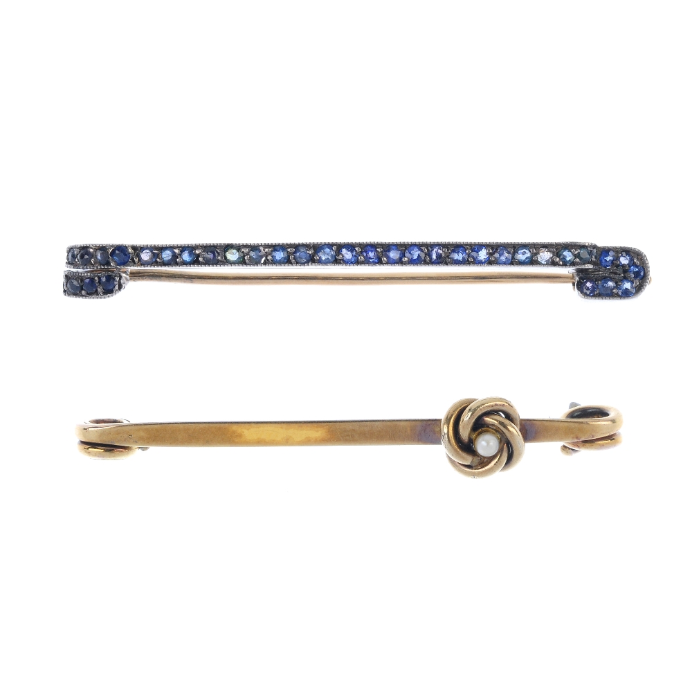 Two early 20th century gem-set bar brooches. To include a sapphire line bar brooch, together with