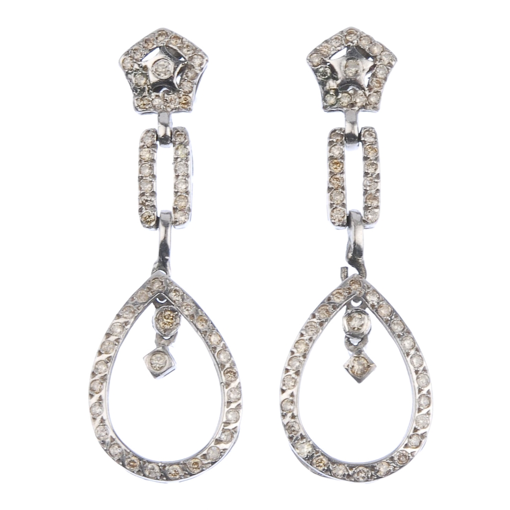 (176761) A pair of pave-set diamond ear pendants. Each designed as a pear-shape dropper to the