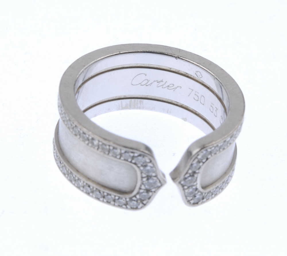 (539290-1-A) CARTIER - a 'C de Cartier' diamond ring. The textured torque band, with brilliant-cut - Image 4 of 4