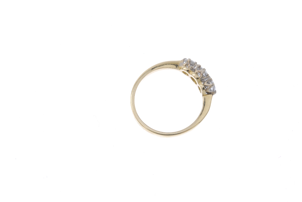 An 18ct gold diamond three-stone ring. The slightly graduated brilliant-cut diamond line, to the - Image 4 of 4