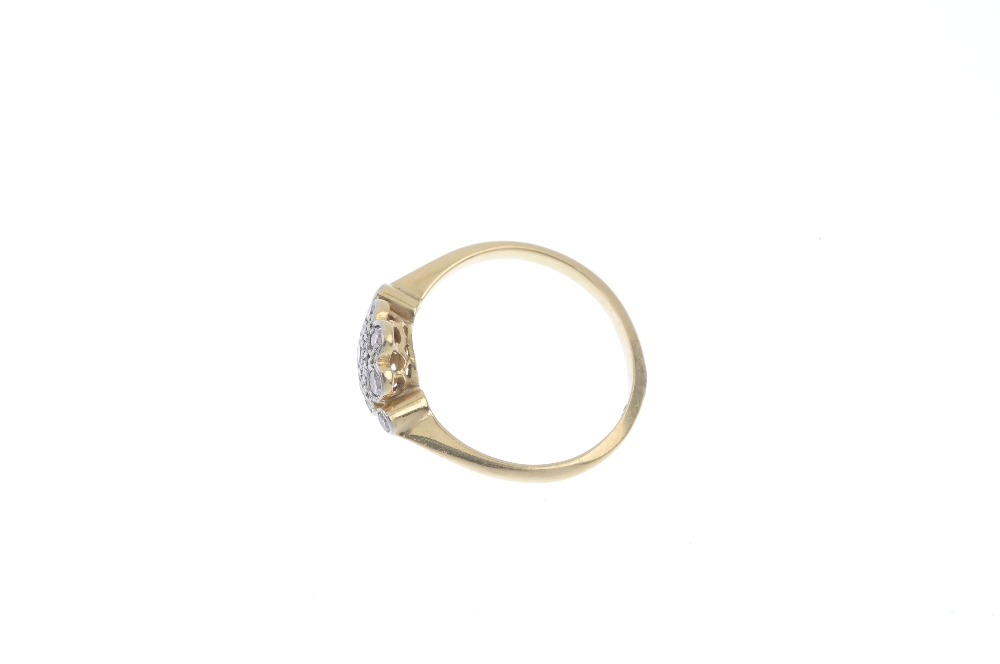 A mid 20th century platinum and 18ct gold diamond cluster ring. The single-cut diamond floral - Image 3 of 4