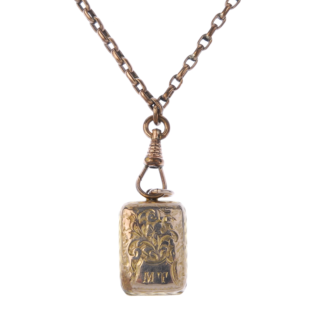 A late Victorian locket, with chain. The rectangular-shape locket with foliate front and back,
