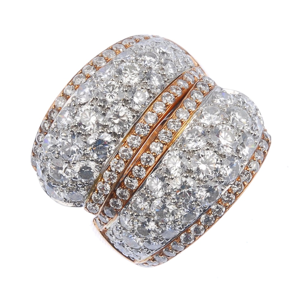 (539295-1-A) A diamond dress ring. Comprising two pave-set diamond tapered panels, each with