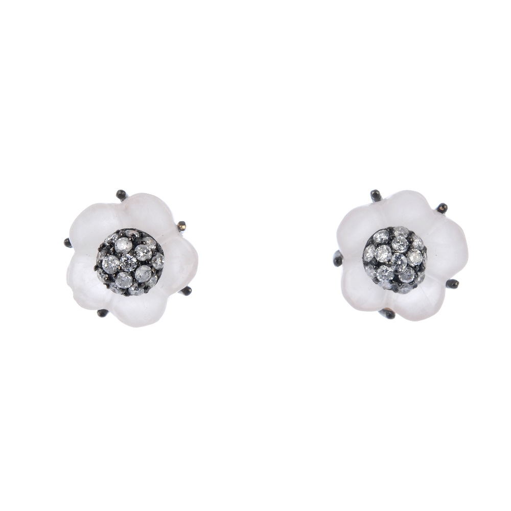 A pair of rose quartz and diamond floral ear studs. Each designed as a brilliant-cut diamond