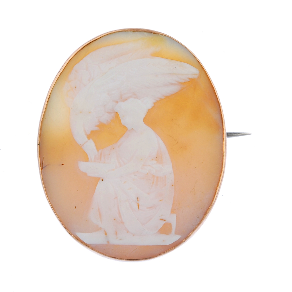 An early 20th century 9ct gold mounted shell cameo brooch. Of oval outline, the shell cameo,