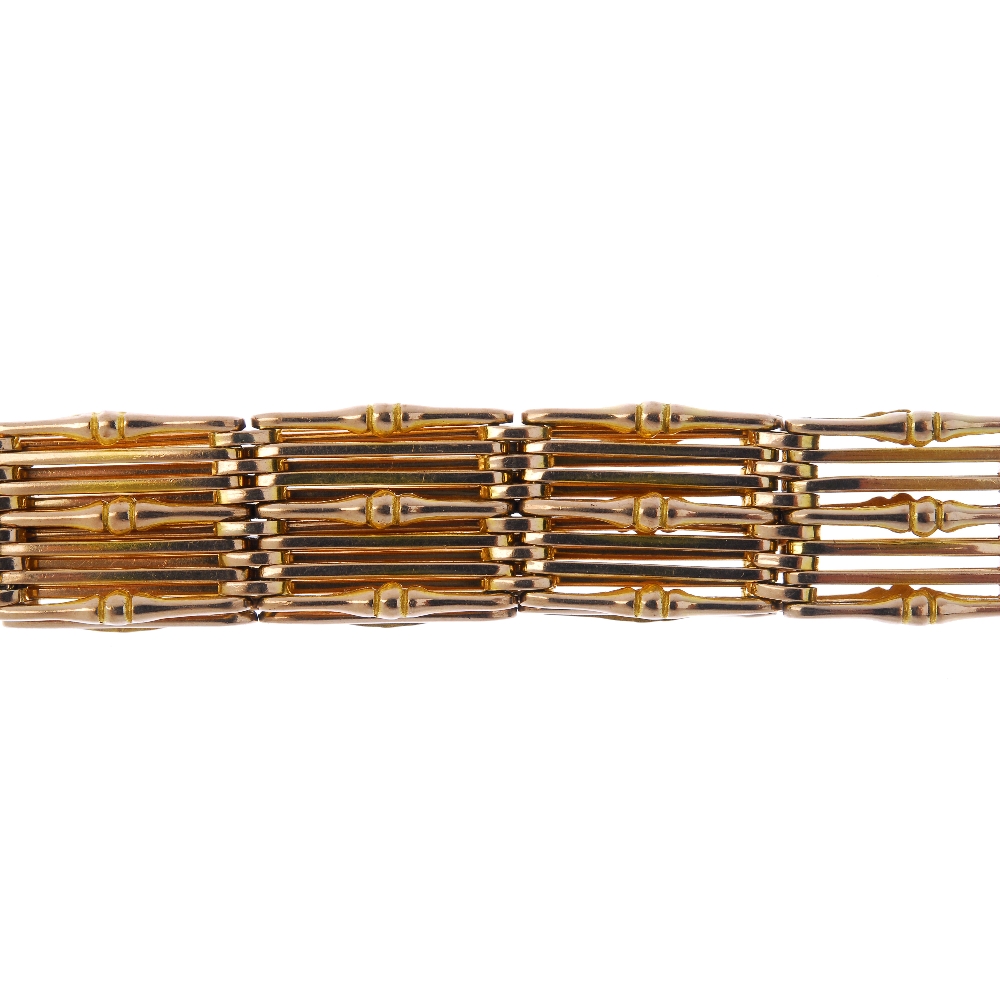 An early 20th century 9ct gold bracelet. Designed as a series of ten plain and twist-bar links, to