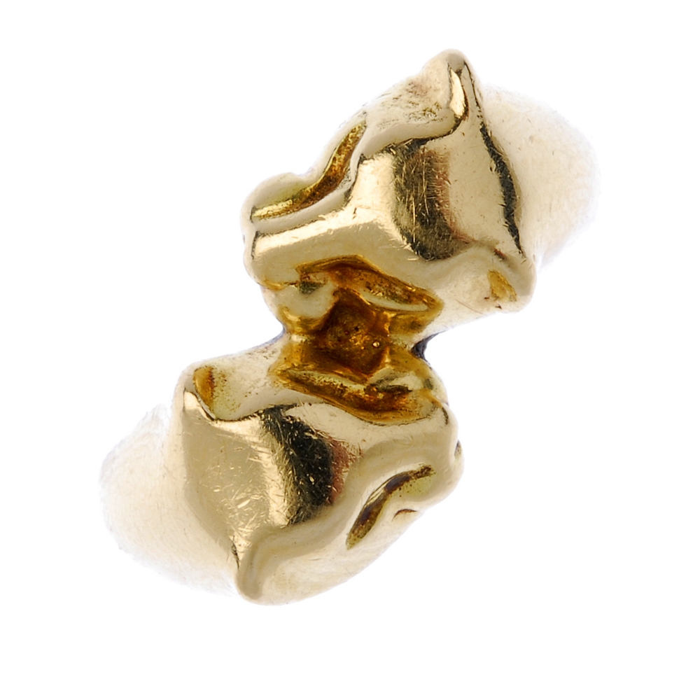 A double panther ring. Designed as two panther heads, to the tapered band. Weight 7.2gms. Overall