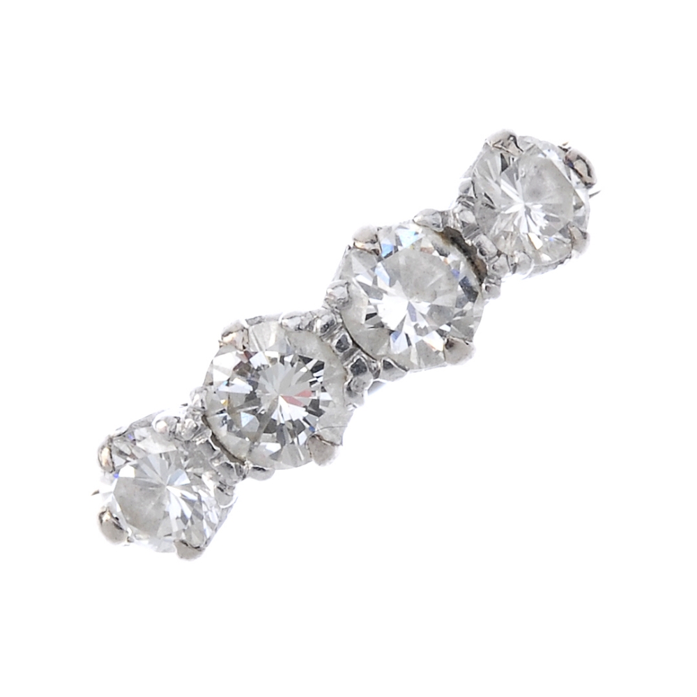 A diamond four-stone ring. The brilliant-cut diamond line, to the plain band. Estimated total