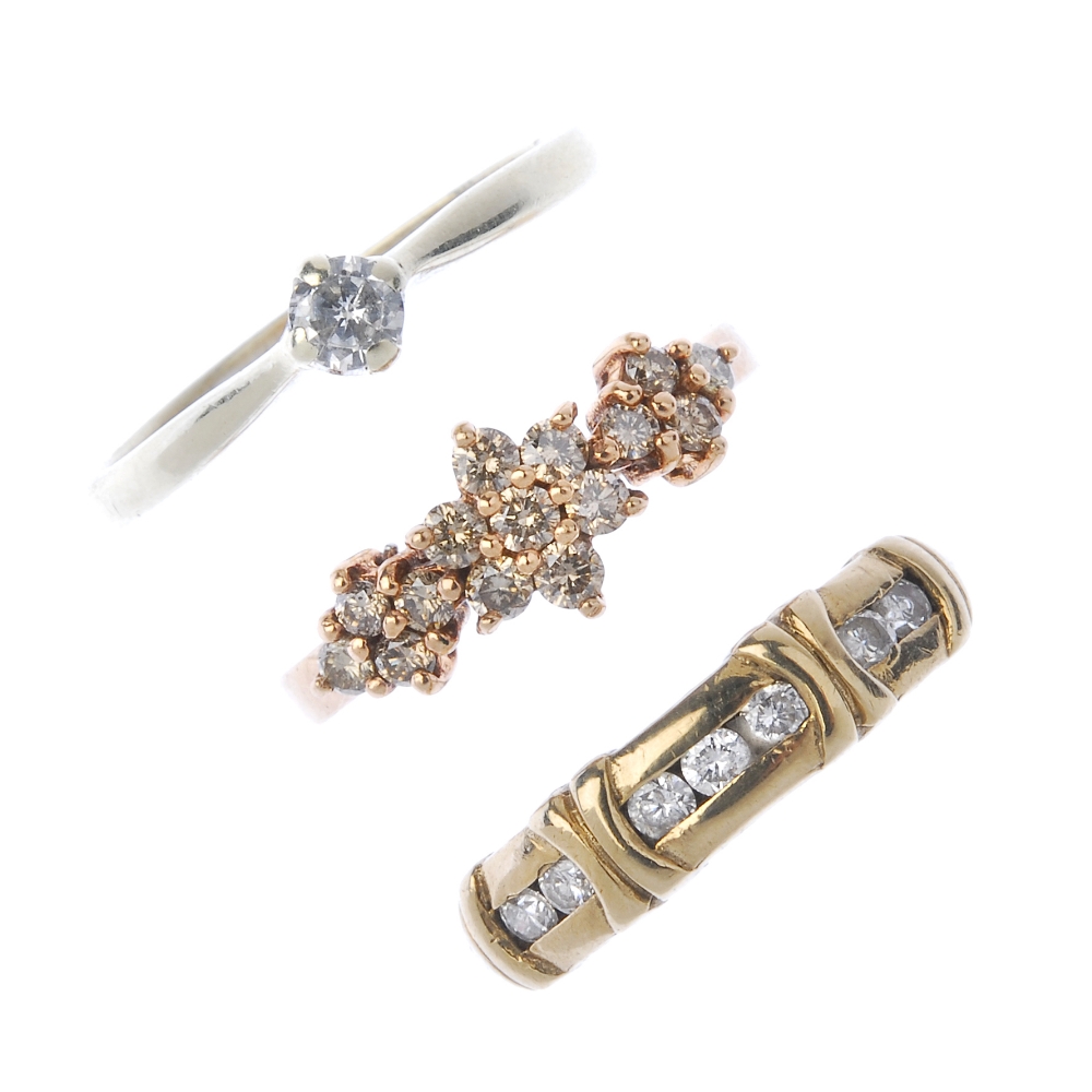 A selection of three 9ct gold diamond rings. To include a brilliant-cut diamond band ring with