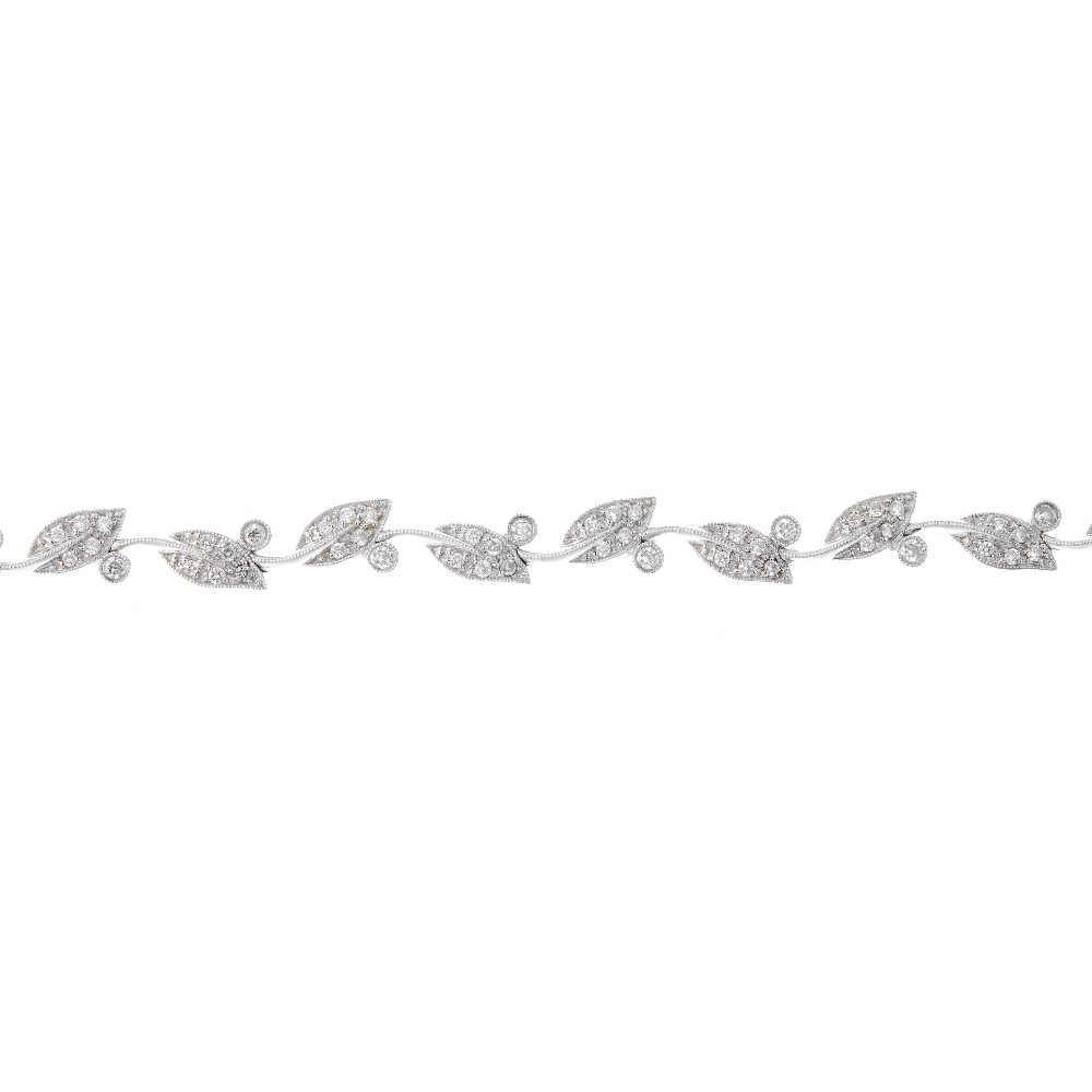 A diamond foliate bracelet. Comprising a series of brilliant-cut diamond leaf links, with