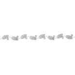 A diamond foliate bracelet. Comprising a series of brilliant-cut diamond leaf links, with