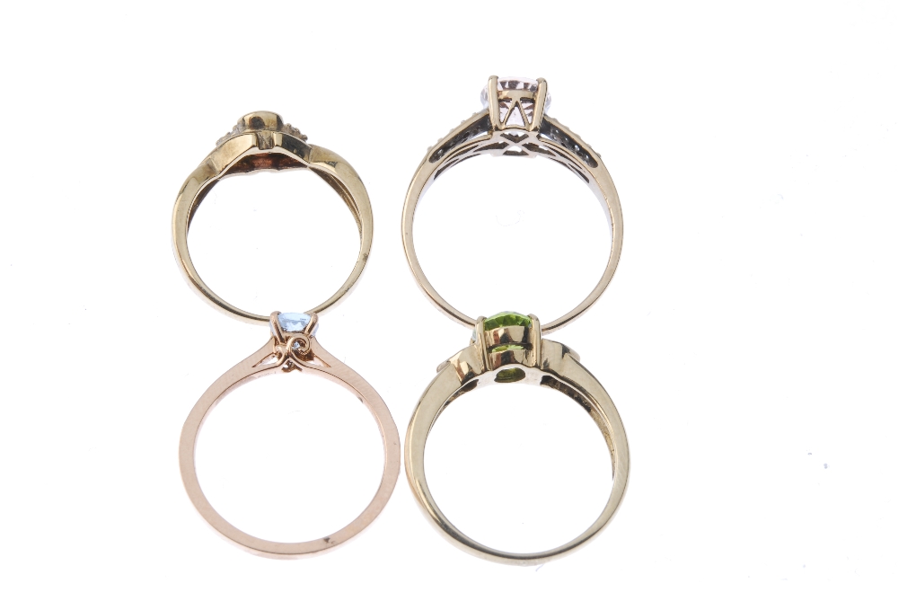 A selection of four gold diamond and gem-set rings. To include a circular-shape blue topaz and - Image 3 of 3