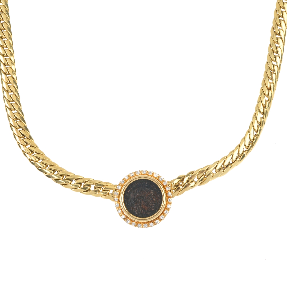 A 'coin' and diamond necklace. The coin-medallion, within a brilliant-cut diamond surround, to the