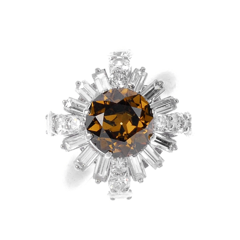(541162-3-A) A coloured diamond and diamond dress ring. The circular-cut 'brown' diamond, within a