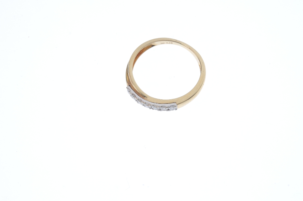 An 18ct gold diamond crossover band ring. The brilliant-cut diamond line crossover centre, to the - Image 2 of 3