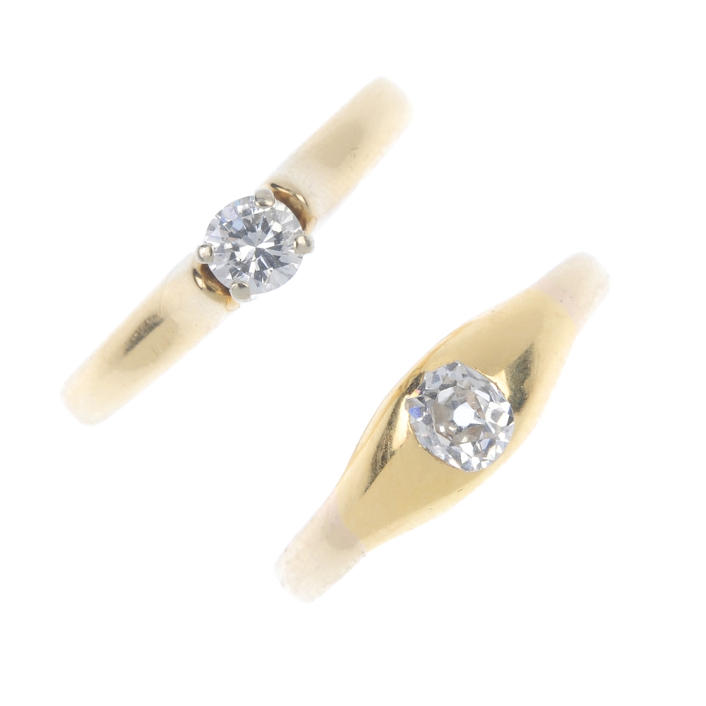 Two diamond single-stone rings. To include a 14ct gold oval-shape diamond single-stone ring,