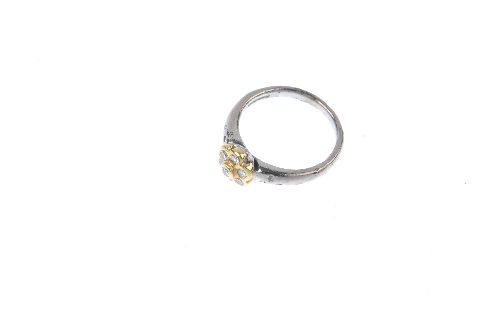 An 18ct gold diamond floral cluster ring. The brilliant-cut diamond collet, within a similarly-cut - Image 2 of 4