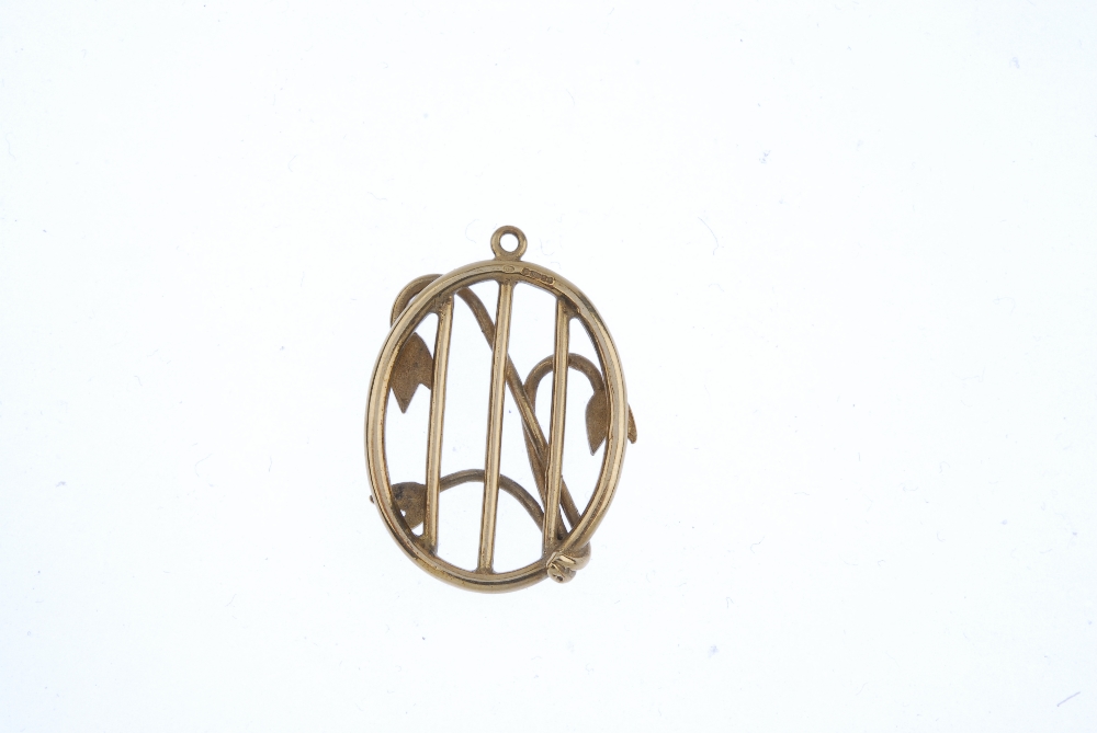 A 9ct gold pendant. Of oval outline, the openwork panel, with floral detail overlay. Hallmarks for - Image 2 of 2