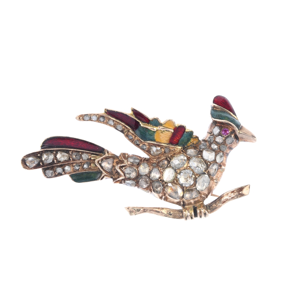 A diamond and enamel bird brooch. The bird with rose-cut diamond body, red gem eye and enamel detail