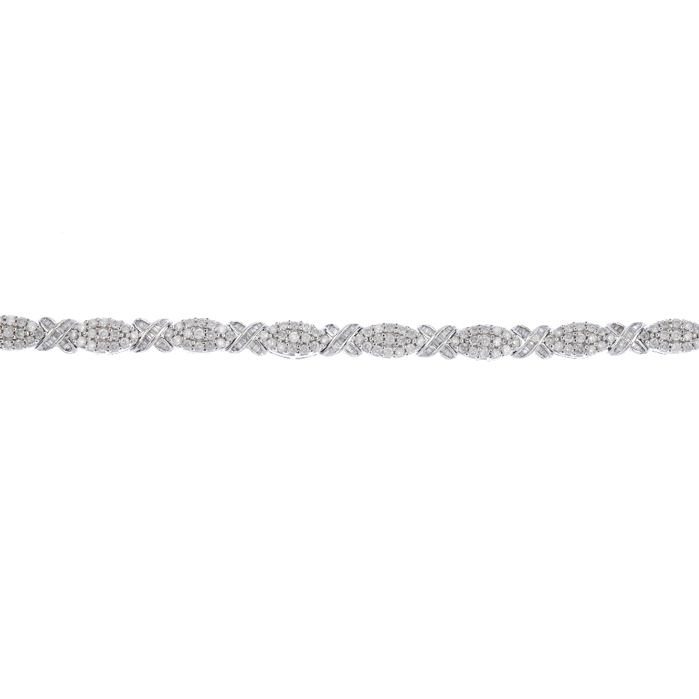 (539726-2-A) A 9ct gold diamond bracelet. Designed as a series of pave-set diamond marquise-shape