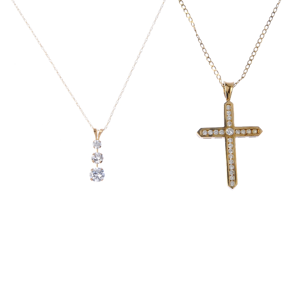 A selection of jewellery. To include a 9ct gold cubic zirconia cross pendant and flat curb-link