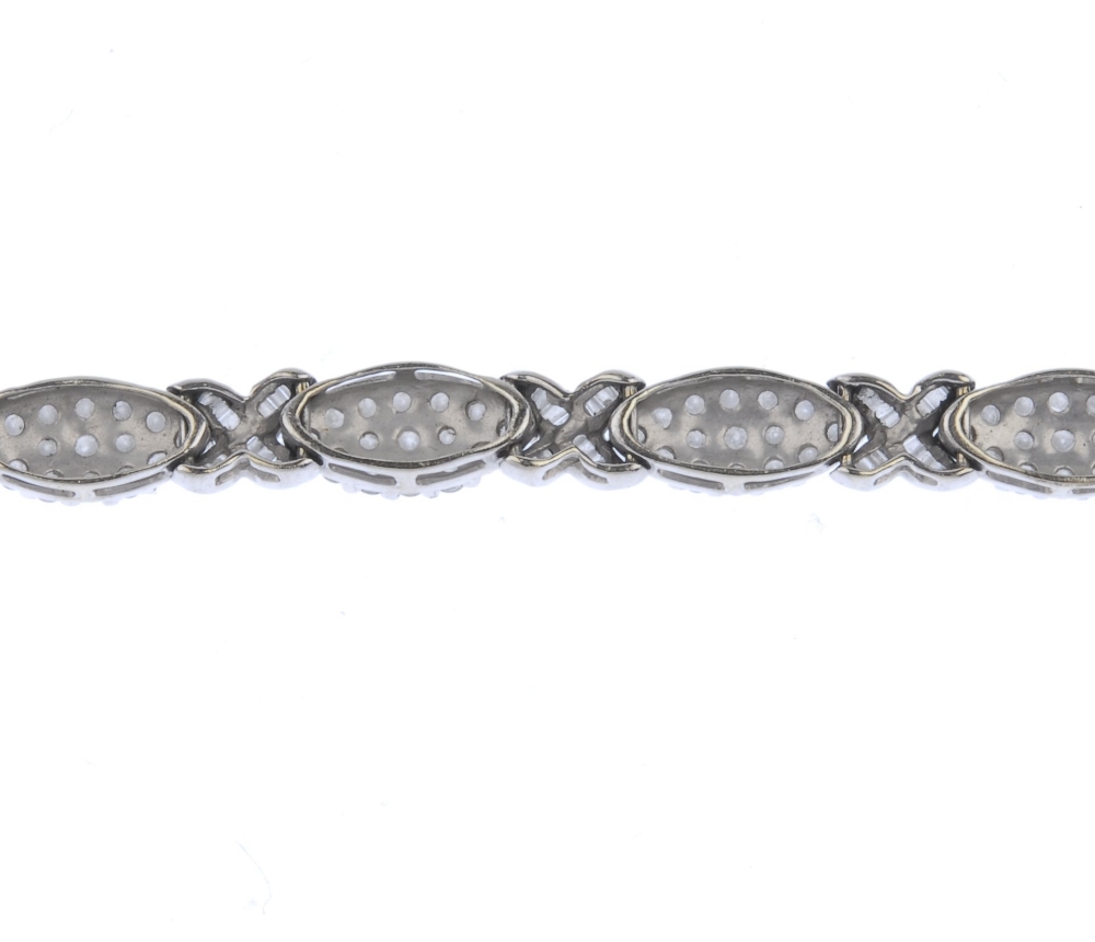 (539726-2-A) A 9ct gold diamond bracelet. Designed as a series of pave-set diamond marquise-shape - Image 3 of 4