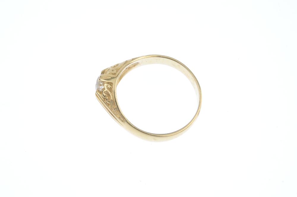 An 18ct gold diamond single-stone ring. The brilliant-cut diamond, to the scrolling sides and - Image 3 of 4