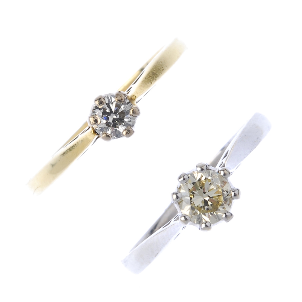 Two 18ct gold diamond rings. Each designed as a brilliant-cut diamond, to the tapered shoulders