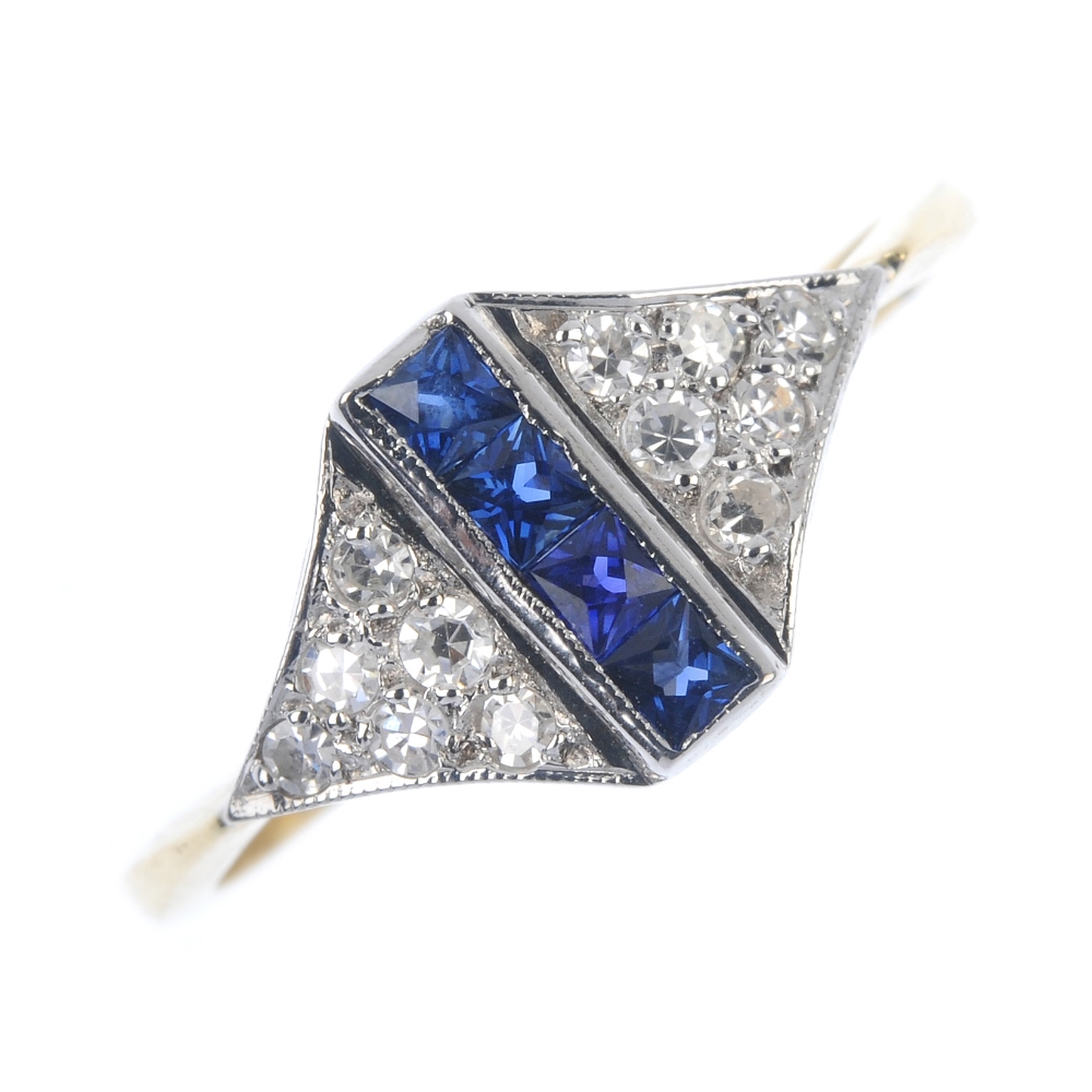 A sapphire and diamond dress ring. The square-shape sapphire line, within a channel setting, to