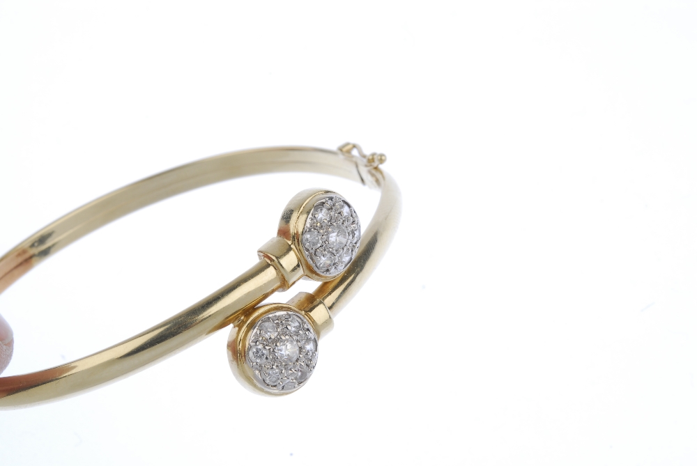 Two bangles. To include a crossover bangle with cubic zirconia cluster terminals, together with a - Image 2 of 3