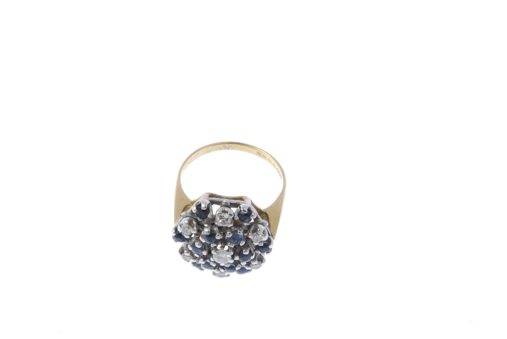 An 18ct gold sapphire and diamond cluster ring. Of openwork design, the brilliant-cut diamond, - Image 2 of 4