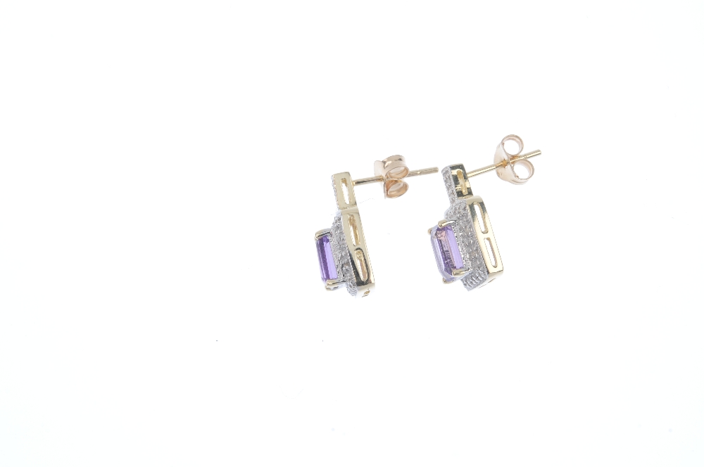 A pair of diamond and amethyst ear pendants. Each designed as a rectangular-shape amethyst, within a - Image 2 of 2