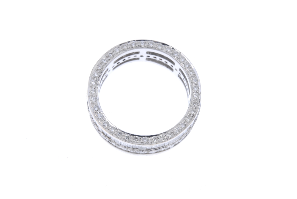 A diamond full-circle eternity ring. The alternating baguette and brilliant-cut diamond lines, to - Image 2 of 3