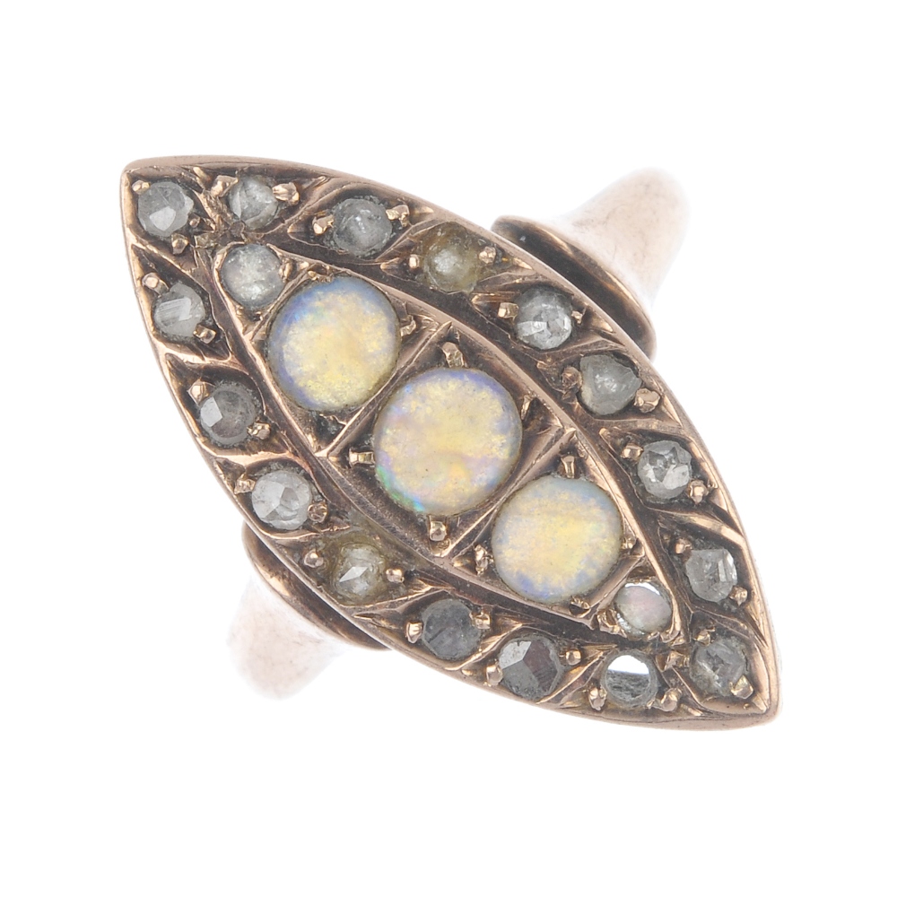 A late Victorian 9ct gold opal and diamond dress ring. Of marquise-shape outline, the graduated