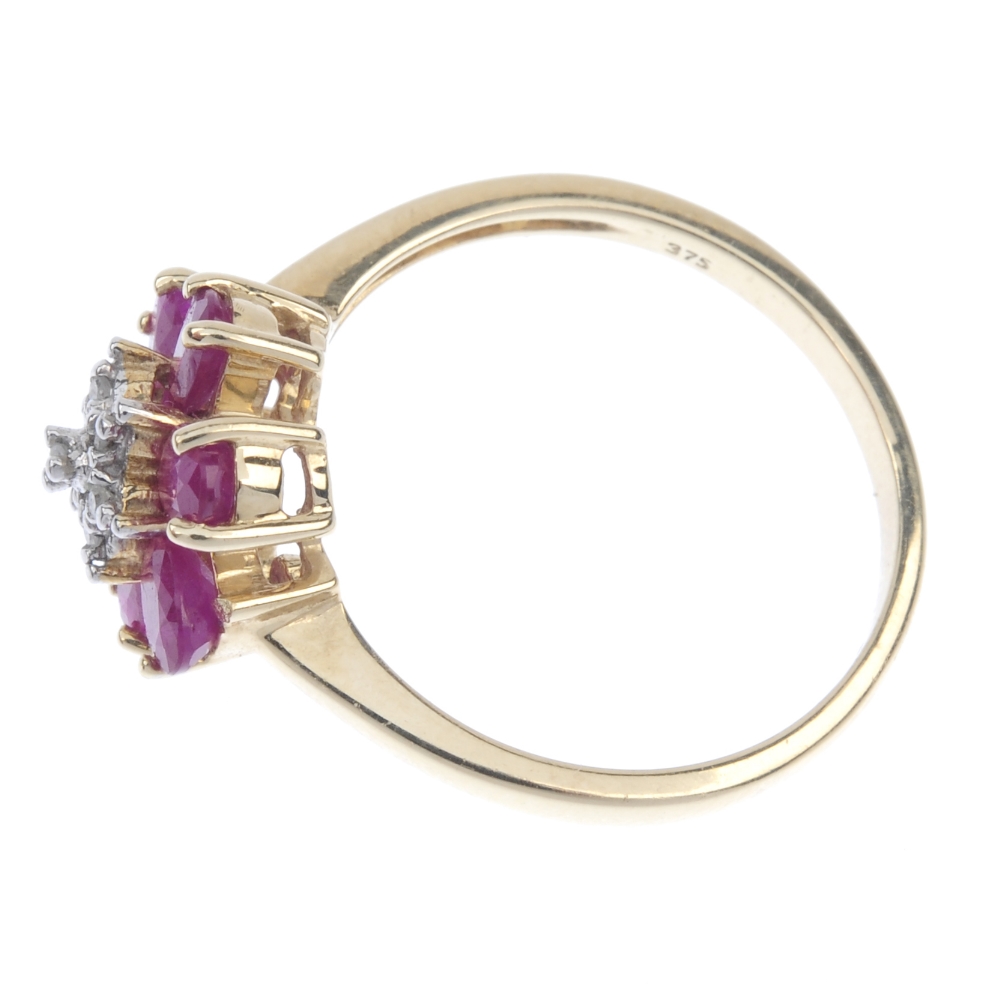 A 9ct gold diamond and ruby floral cluster ring. The single-cut diamond stepped cluster, within an - Image 3 of 4