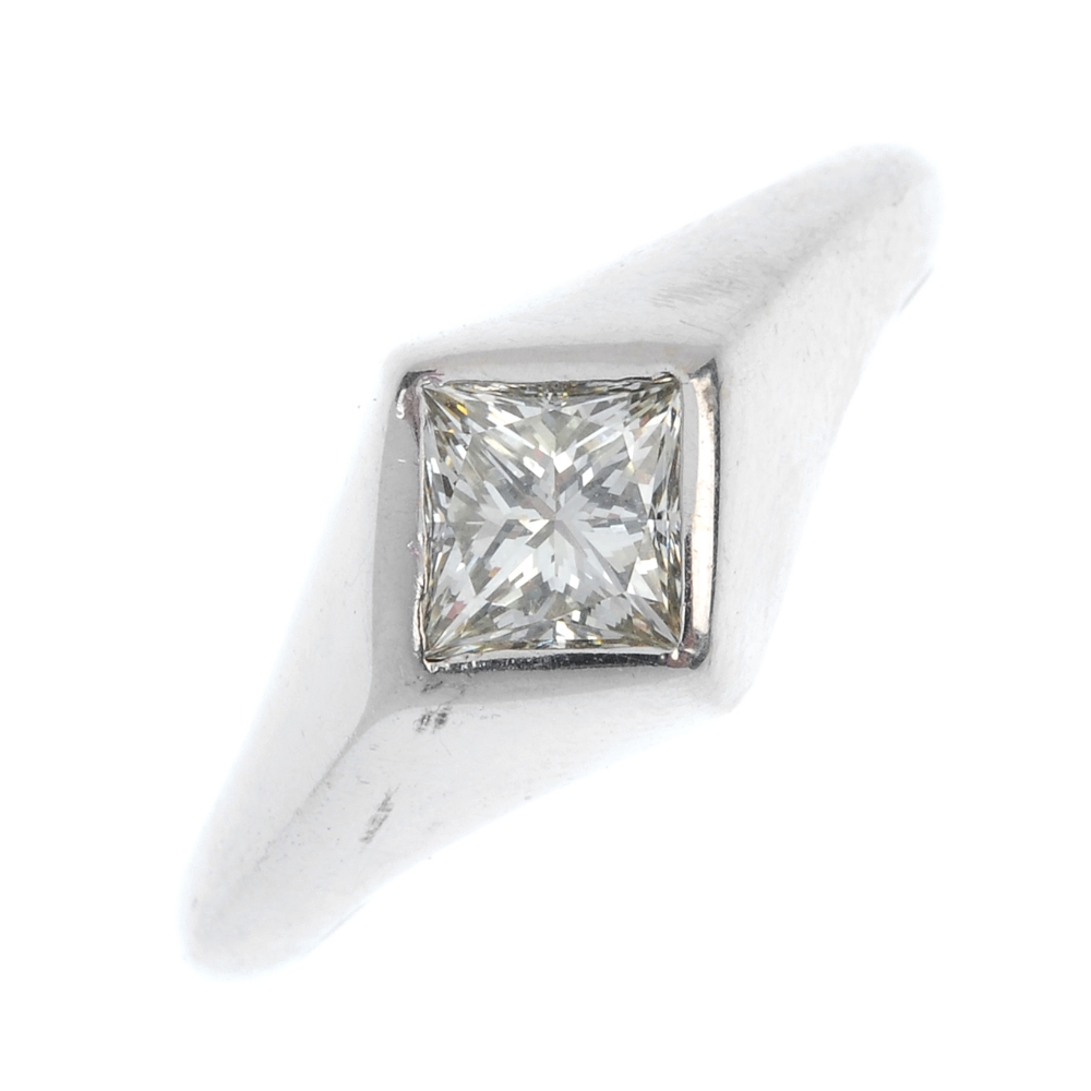 A 9ct gold diamond single-stone ring. The square-shape diamond, inset to the plain band. Estimated