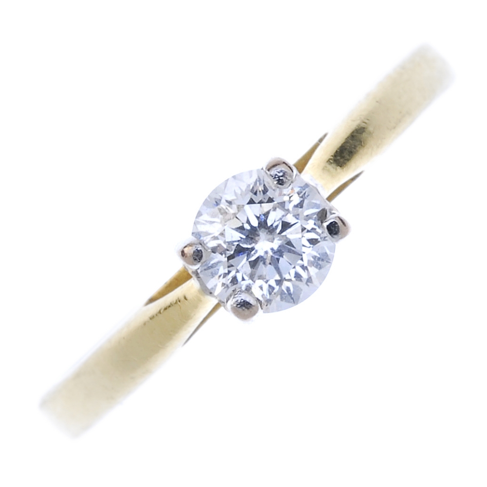 An 18ct gold diamond single-stone ring. The circular-cut diamond, to the tapered band. Diamond